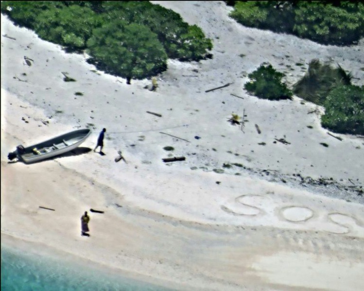 Repérés grâce à un "SOS" dessiné sur le sable