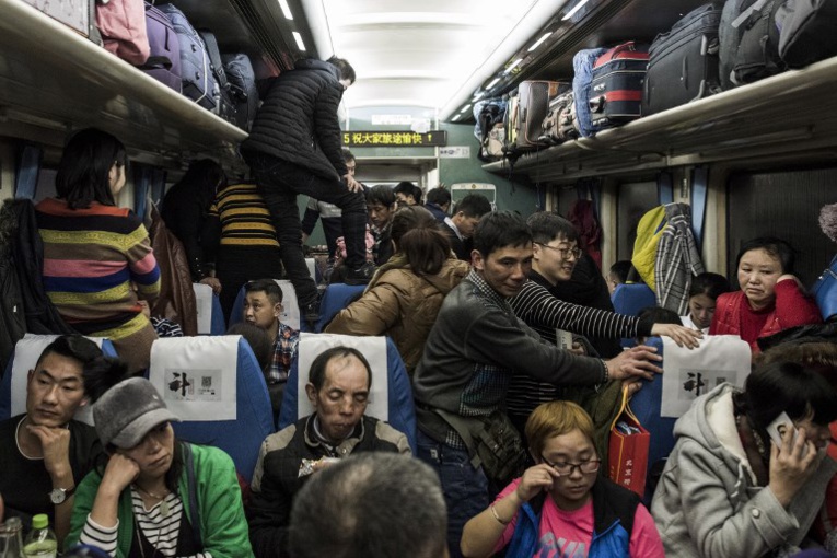 Chine: dans le train du Nouvel an, entre joie et amertume Chine: dans le train du Nouvel an, entre joie et amertume