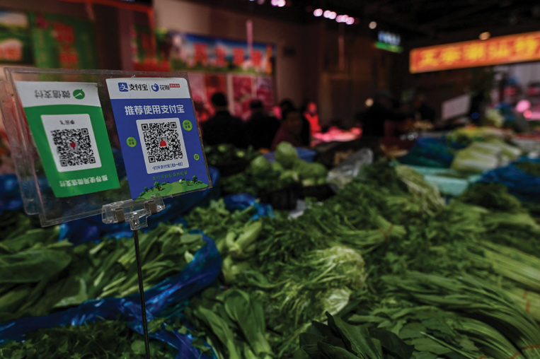 Pour contrer le dollar, Pékin parie sur sa monnaie numérique Pour contrer le dollar, Pékin parie sur sa monnaie numérique