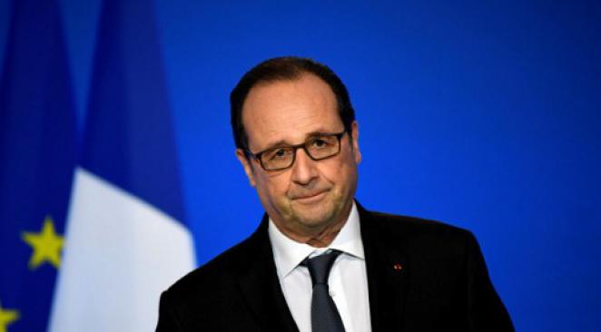 France/présidentielle: Hollande adoube Macron à Bruxelles pour faire barrage à Marine Le Pen