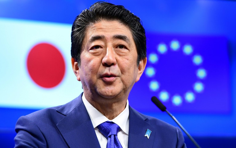 Le premier ministre japonais était à Bruxelles en mars dernier (© AFP | EMMANUEL DUNAND)