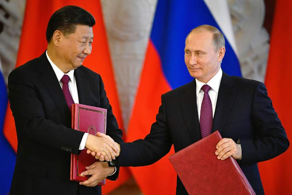 Xi discute commerce et Corée du Nord avec Poutine