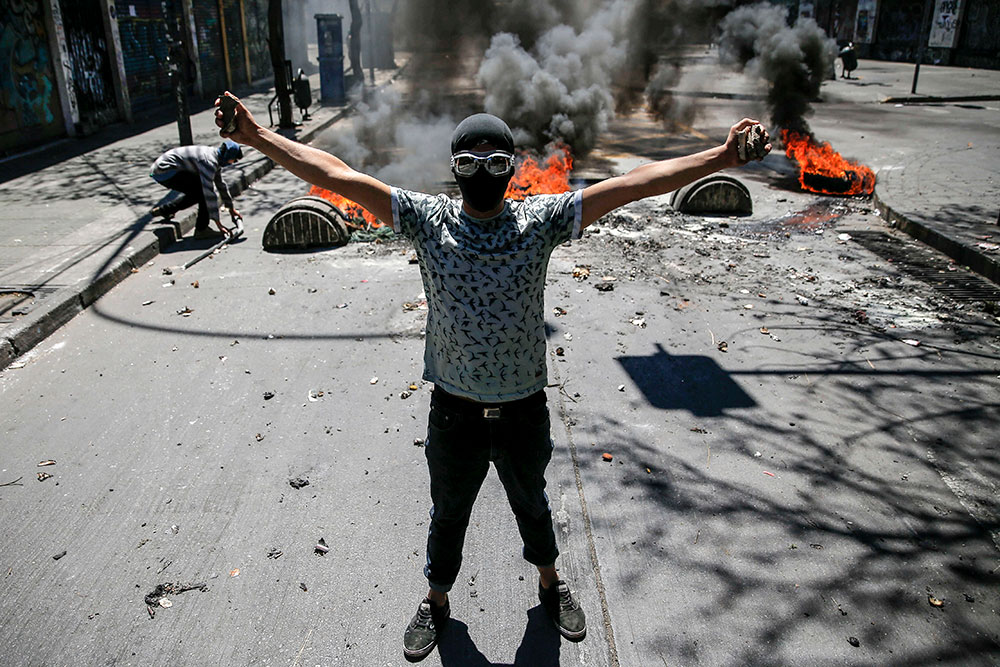 Chili: le président réunit les partis pour chercher une issue à la crise sociale