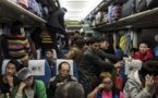 Chine: dans le train du Nouvel an, entre joie et amertume