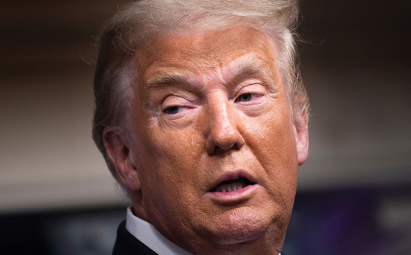 Trump, absent omniprésent à l'ouverture de son procès historique