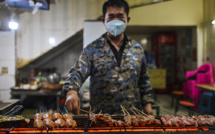 Chine: les sulfureux marchés de Wuhan rouvrent à l'ombre du virus