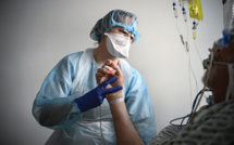 Covid: la barre des 100.000 morts dépassée, encore des "jours difficiles"